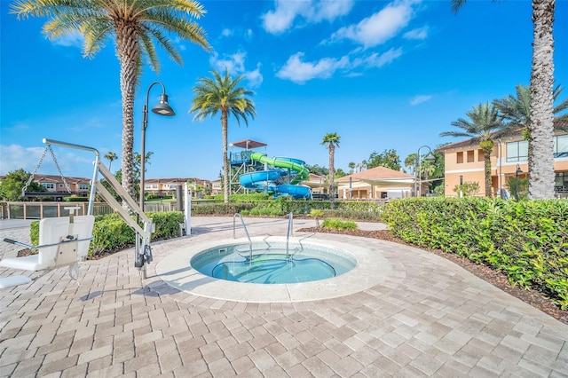 view of pool featuring a hot tub