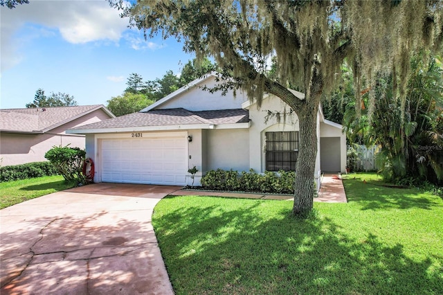 ranch-style house featuring a garage and a front yard