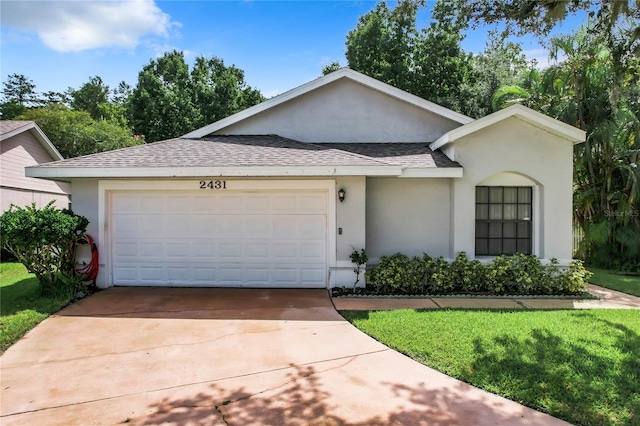 ranch-style house with a garage and a front yard