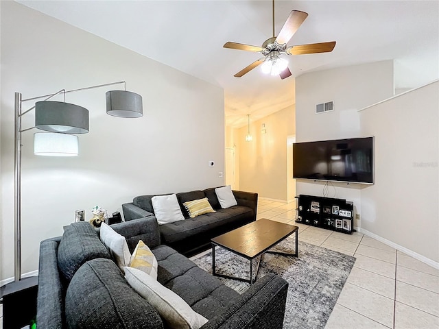 tiled living room featuring lofted ceiling and ceiling fan