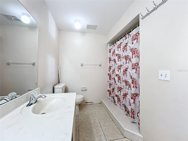 bathroom featuring curtained shower, tile patterned flooring, toilet, and vanity