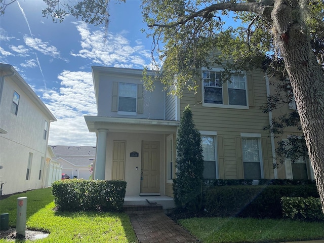 view of front of house featuring a front lawn