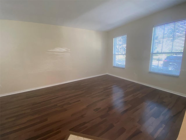 spare room featuring dark hardwood / wood-style floors