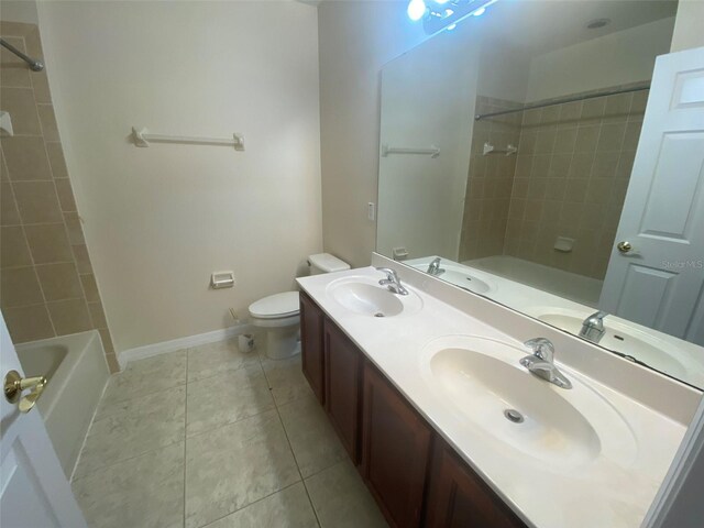 full bathroom with vanity, toilet, tile patterned floors, and tiled shower / bath