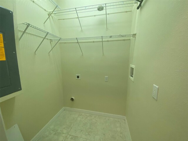 washroom featuring washer hookup, electric panel, hookup for an electric dryer, and tile patterned floors