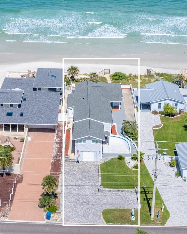 bird's eye view featuring a water view, a residential view, and a beach view