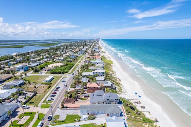 bird's eye view featuring a water view and a view of the beach