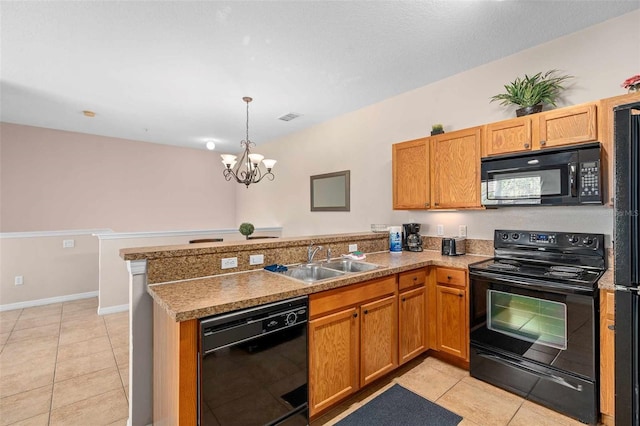 kitchen with black appliances, light tile patterned floors, kitchen peninsula, sink, and a chandelier