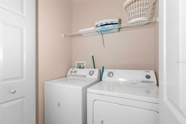 laundry area featuring independent washer and dryer