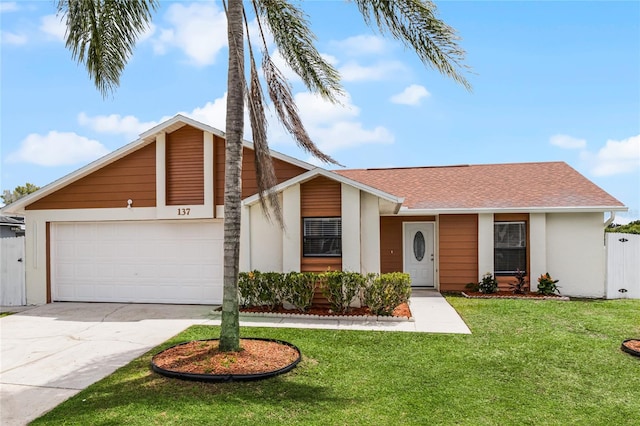 ranch-style home with a garage and a front yard