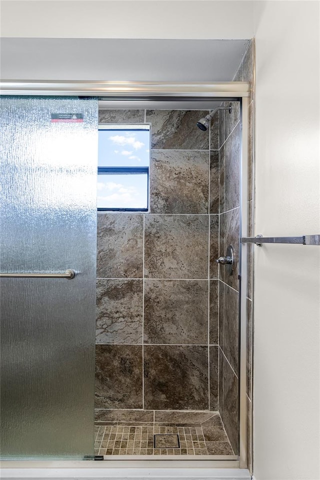 bathroom featuring an enclosed shower