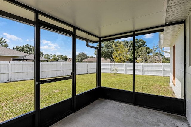 unfurnished sunroom featuring a wealth of natural light