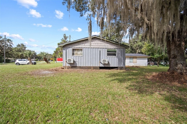 view of front of property with an outdoor structure, a front lawn, and cooling unit