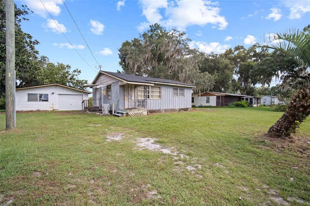 view of yard with an outdoor structure and a garage