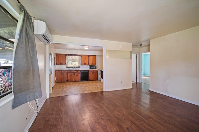 interior space with dark hardwood / wood-style flooring, a wealth of natural light, and an AC wall unit