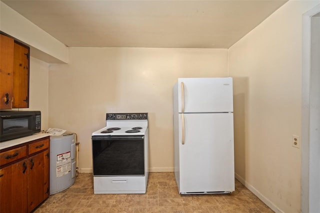 kitchen with white appliances and water heater