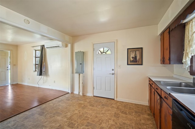 kitchen featuring electric panel, dishwasher, a healthy amount of sunlight, and light hardwood / wood-style floors