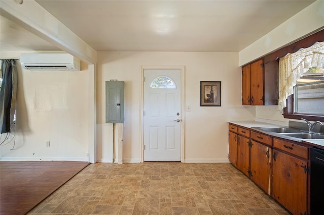 kitchen with electric panel, sink, a wall unit AC, and black dishwasher