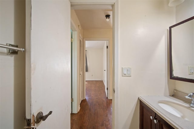 bathroom with hardwood / wood-style flooring and vanity