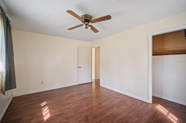 unfurnished bedroom with ceiling fan, dark hardwood / wood-style floors, and a closet