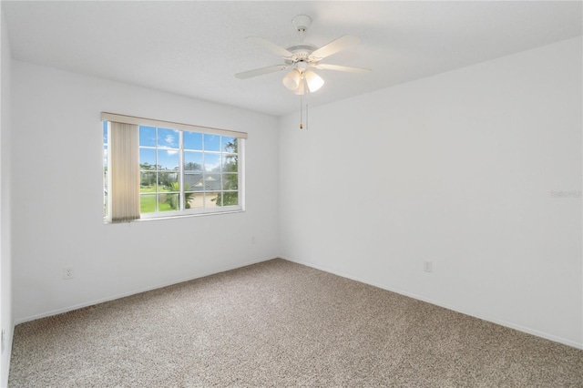 carpeted empty room with ceiling fan