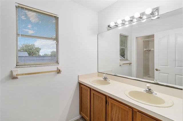 bathroom with double vanity, shower / tub combination, and a sink