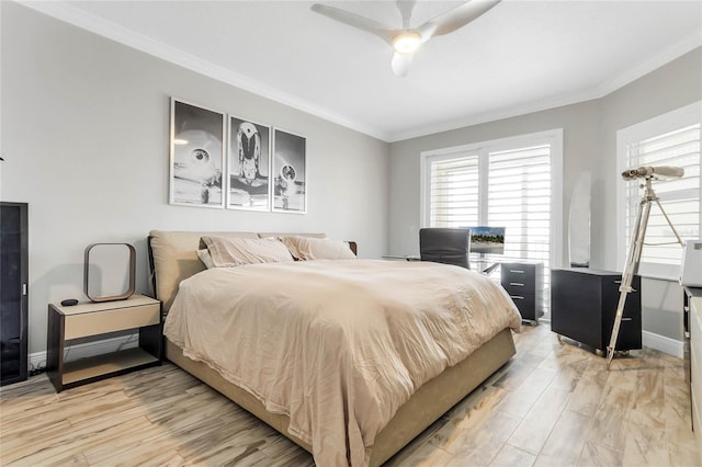 bedroom with crown molding, ceiling fan, and light hardwood / wood-style floors