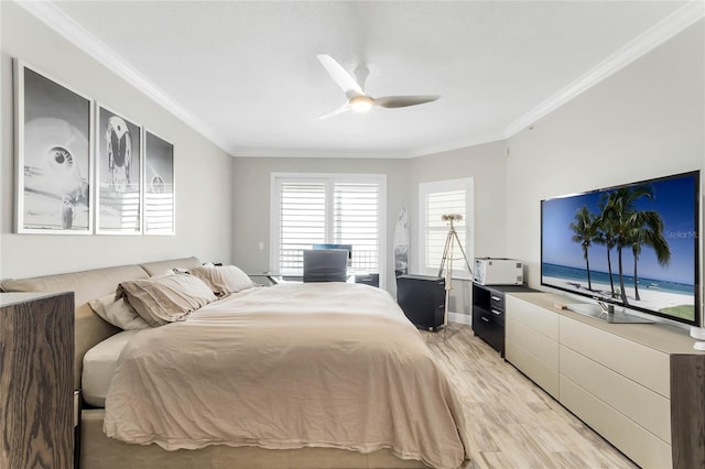 bedroom with ceiling fan, crown molding, and light hardwood / wood-style flooring