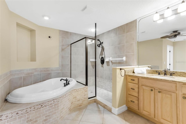 bathroom featuring vanity, separate shower and tub, ceiling fan, and tile patterned floors