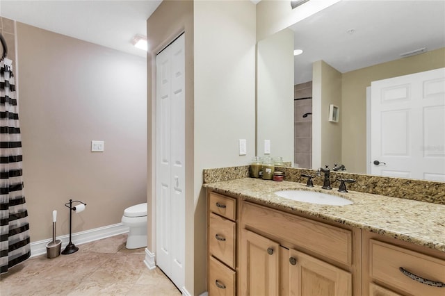 bathroom with tile patterned floors, walk in shower, toilet, and vanity