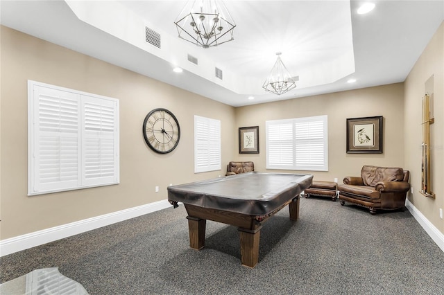 recreation room with a tray ceiling, dark carpet, an inviting chandelier, and pool table