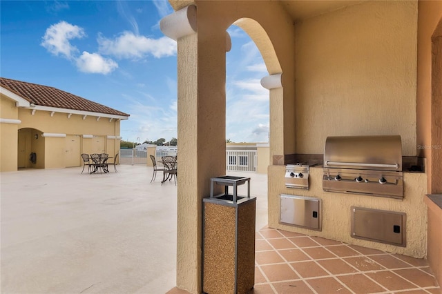 view of patio / terrace featuring an outdoor kitchen and area for grilling