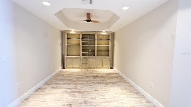 93 Delannoy Ave Unit 904, Cocoa, FL 32922 - empty room featuring a ceiling fan, baseboards, recessed lighting, and a tray ceiling