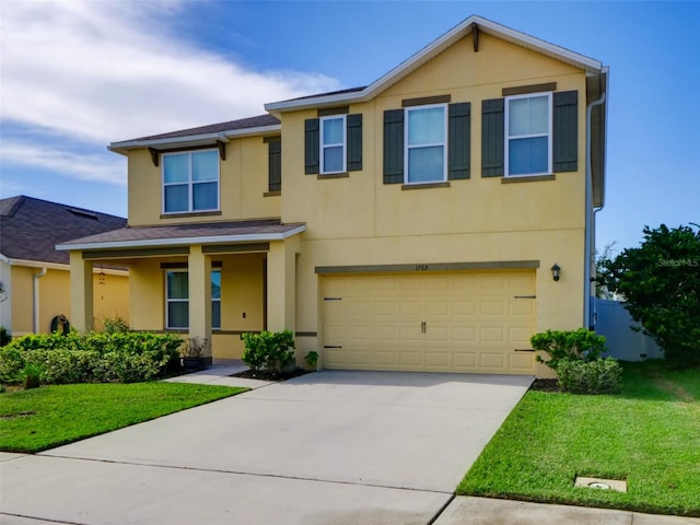 view of front of property with a garage and a front yard