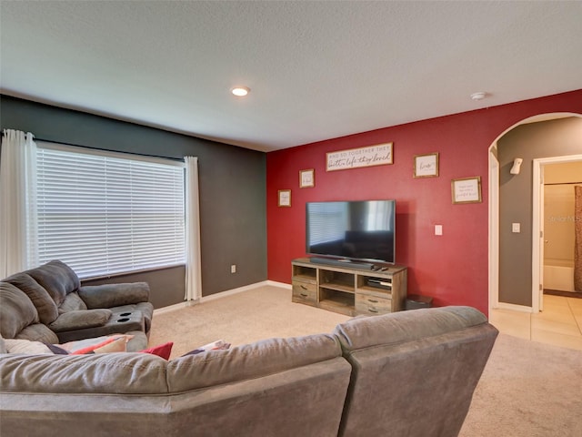 tiled living room with a textured ceiling