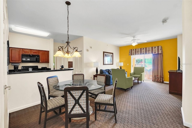 dining space with baseboards, dark carpet, and ceiling fan with notable chandelier