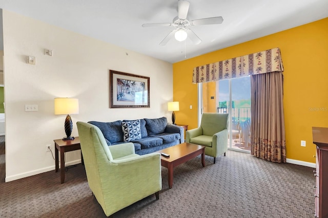 living area with carpet flooring, a ceiling fan, and baseboards