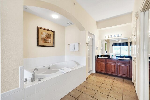 bathroom featuring tile patterned flooring, vanity, ceiling fan, and independent shower and bath