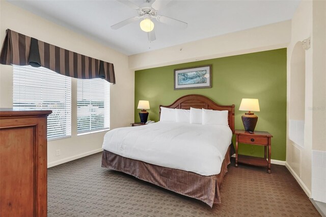 bedroom with ceiling fan and carpet floors