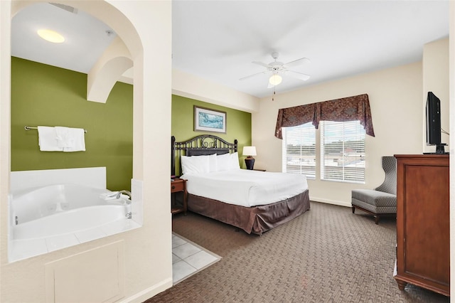 bedroom with ceiling fan and light colored carpet