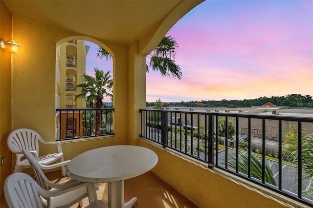 view of balcony at dusk