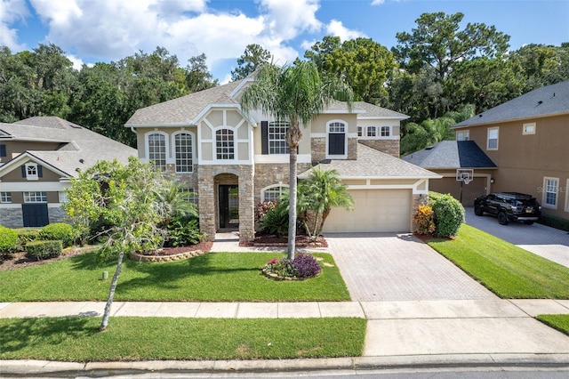 view of front of home featuring a garage and a front lawn