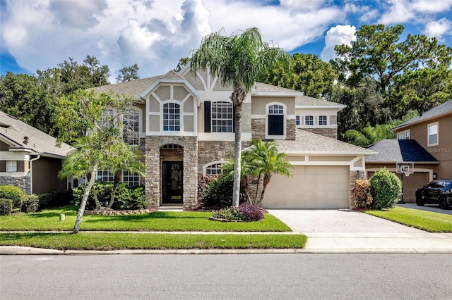 view of front of home with a garage and a front yard