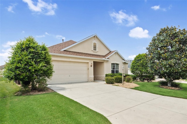 view of front of property featuring a garage and a front yard