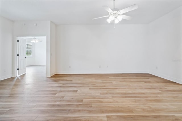 empty room with light wood-type flooring and ceiling fan