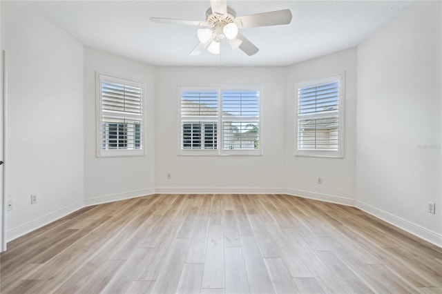 spare room with ceiling fan and light hardwood / wood-style floors