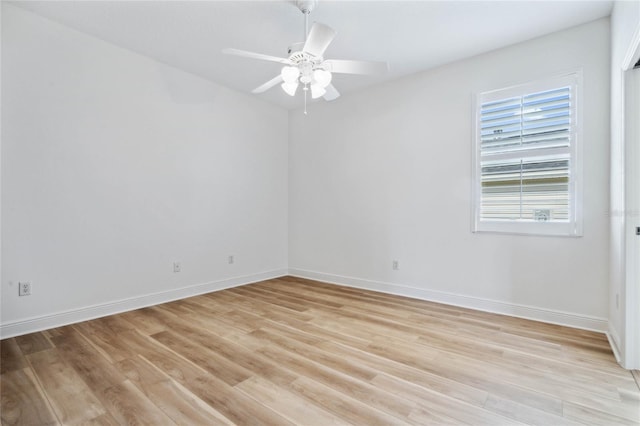 empty room featuring ceiling fan and light hardwood / wood-style floors