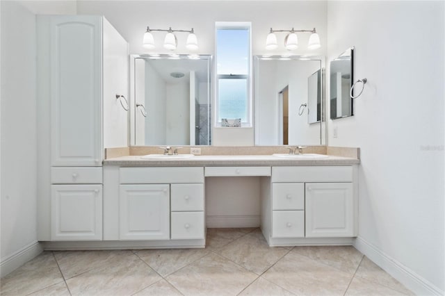 bathroom with vanity and tile patterned flooring