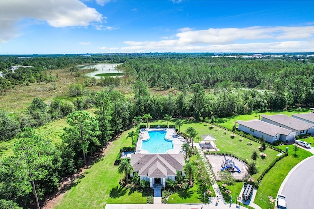 drone / aerial view featuring a view of trees