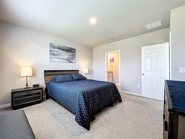 bedroom featuring visible vents, a textured ceiling, baseboards, and carpet